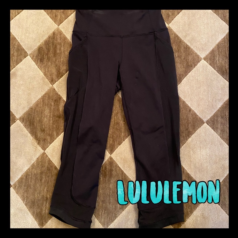 Black Lululemon crop leggings with mesh panels